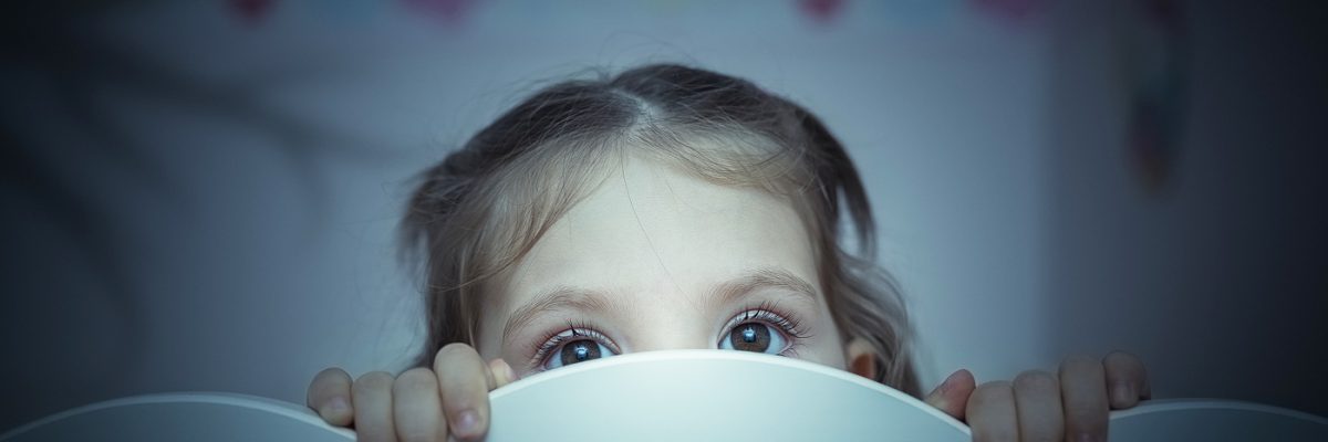 little girl is afraid of shadow