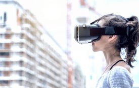 This is a photo of a young woman wearing a virtual-reality headset