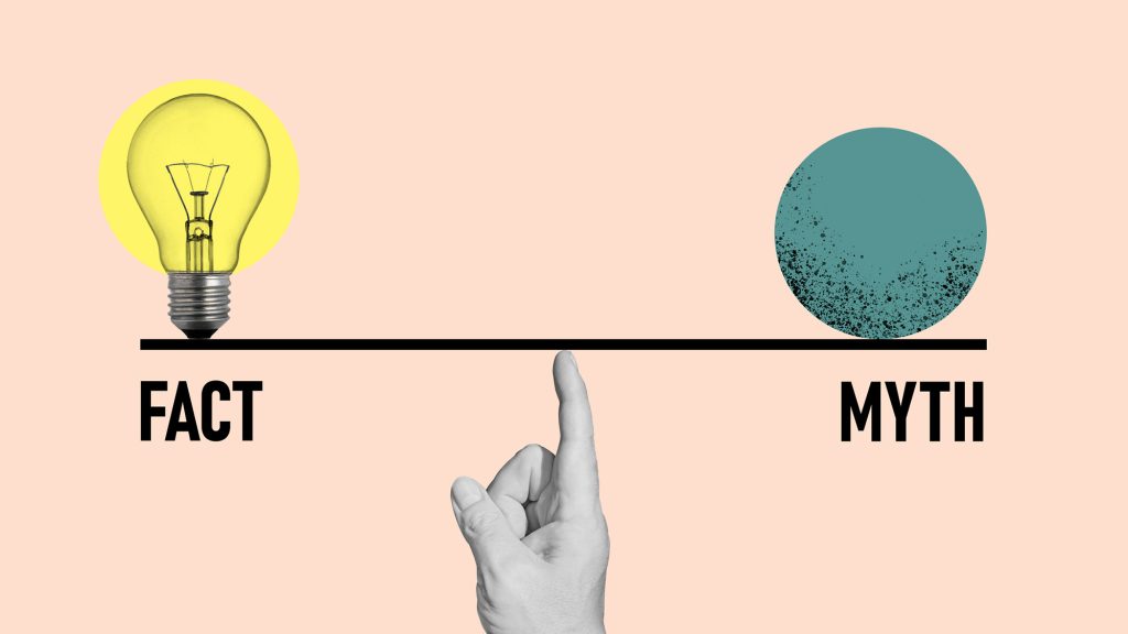 Finger holding a scale with Fact on the left and Myth on the right.